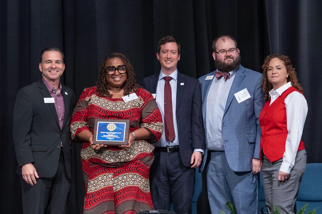 Dr. Valerie Burrell accepts the Primitivo Delgado Christian Service Award