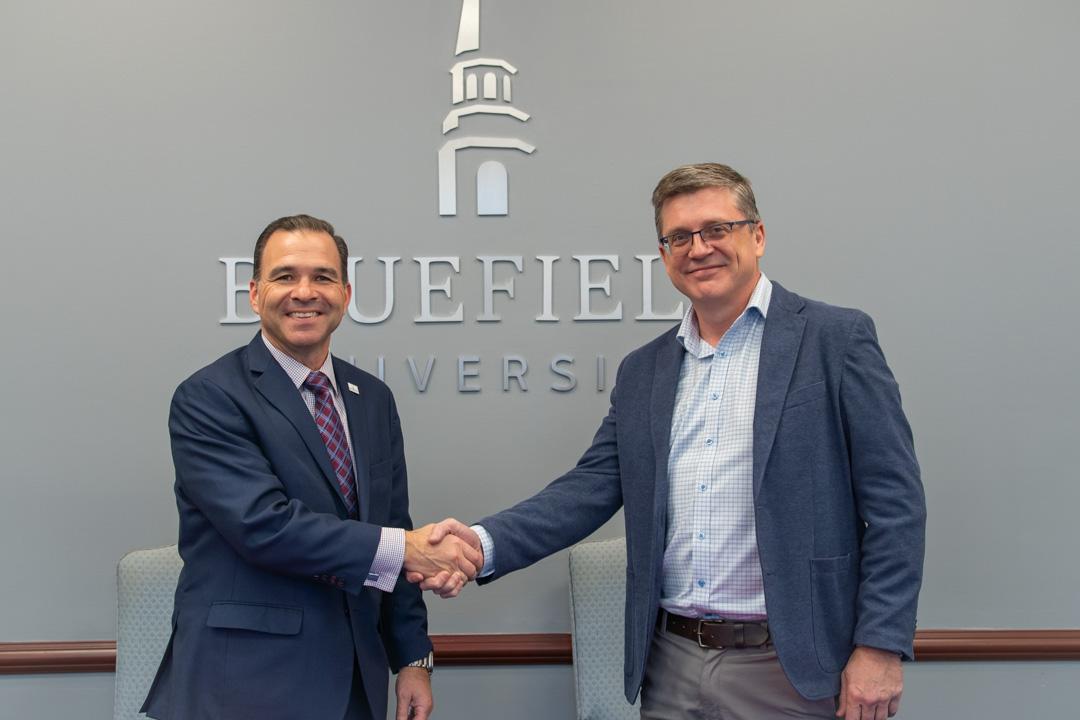 Dr. Peterson shakes hands with Michael Clemons 