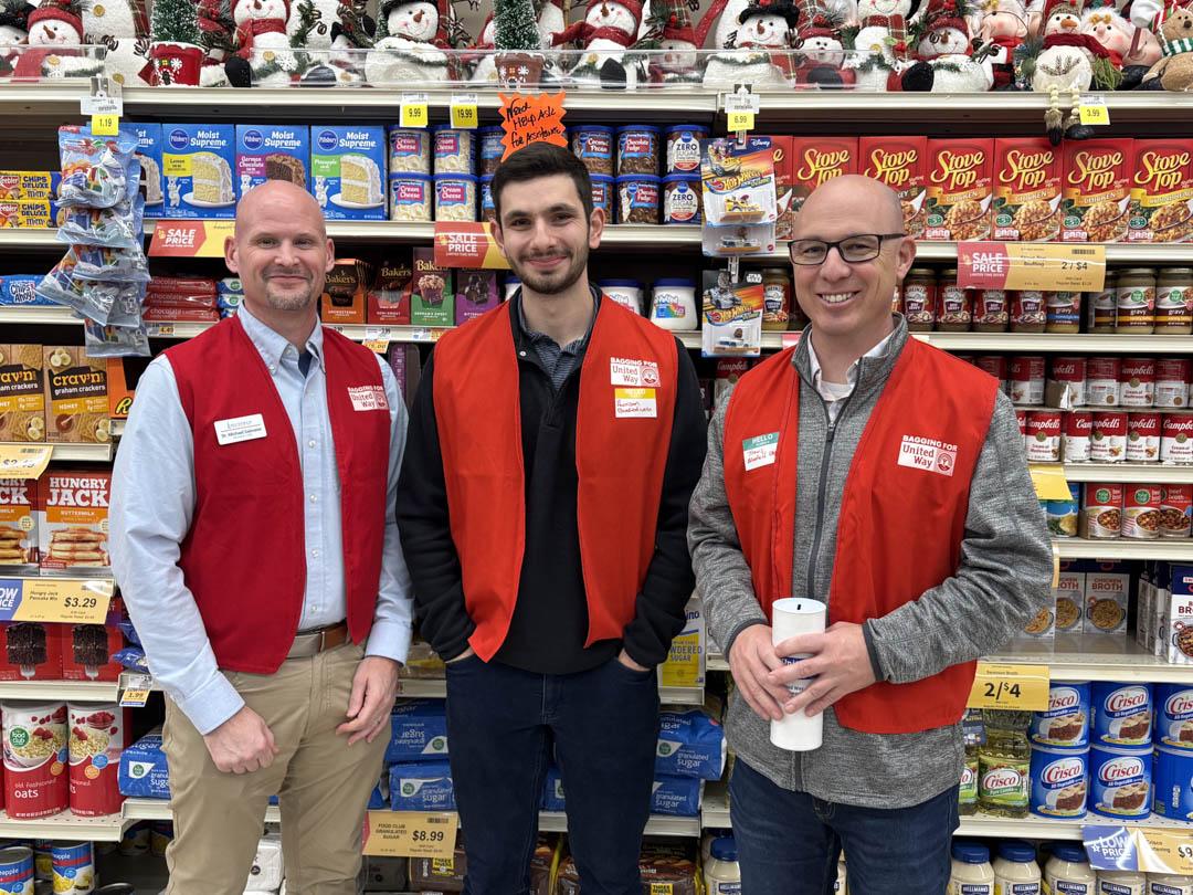 Dr. Michael Salmeier, Harrison Rice and Travis Roberts wearing United Way vests